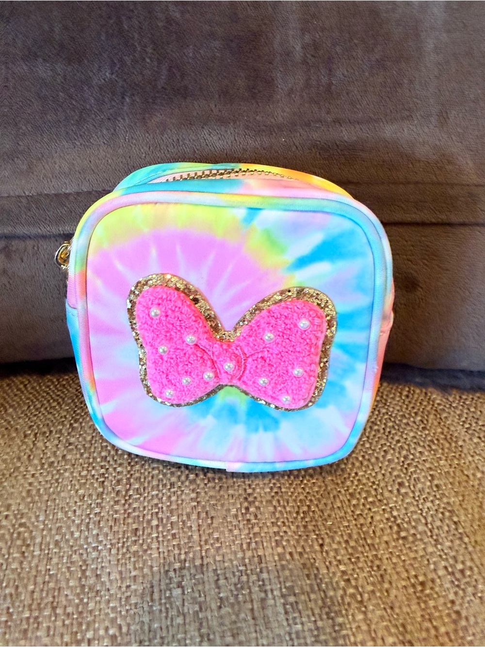 Stoney clover lane mini pouch tie dye with Minnie bow patch stuck on.